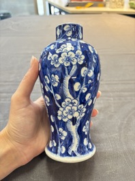 Three Chinese blue and white 'plum blossom' vases and covers, Kangxi mark, 19th C.