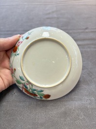 Seven Chinese famille rose cups and eleven saucers with floral design, Qianlong
