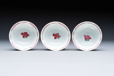 Three Chinese famille rose cups and saucers with a duck among flowering branches, Yongzheng/Qianlong