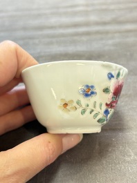 Seven Chinese famille rose cups and eleven saucers with floral design, Qianlong