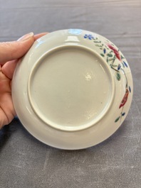 Seven Chinese famille rose cups and eleven saucers with floral design, Qianlong