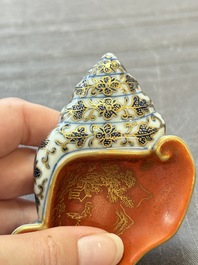 A Chinese blue, white and iron-red gilt-decorated conch-form ink palette with landscape design, Jiaqing mark and of the period