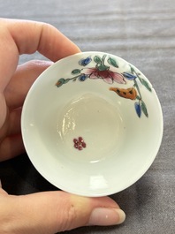 Seven Chinese famille rose cups and eleven saucers with floral design, Qianlong