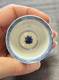 Three Chinese blue and white teapots, a cup and a saucer, Kangxi