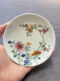 Seven Chinese famille rose cups and eleven saucers with floral design, Qianlong