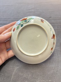 Seven Chinese famille rose cups and eleven saucers with floral design, Qianlong