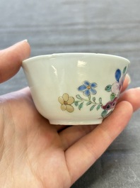 Seven Chinese famille rose cups and eleven saucers with floral design, Qianlong