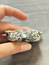 A Chinese blue, white and iron-red gilt-decorated conch-form ink palette with landscape design, Jiaqing mark and of the period