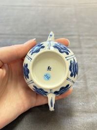 Three Chinese blue and white teapots, a cup and a saucer, Kangxi