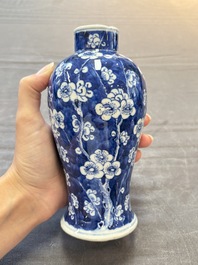 Three Chinese blue and white 'plum blossom' vases and covers, Kangxi mark, 19th C.