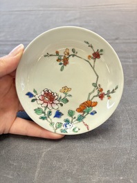 Seven Chinese famille rose cups and eleven saucers with floral design, Qianlong