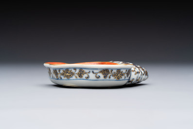 A Chinese blue, white and iron-red gilt-decorated conch-form ink palette with landscape design, Jiaqing mark and of the period