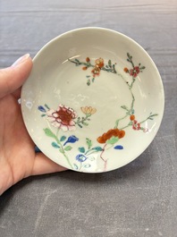 Seven Chinese famille rose cups and eleven saucers with floral design, Qianlong