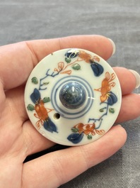 A Chinese verte-Imari teapot and a blue and white teapot with floral design, Kangxi