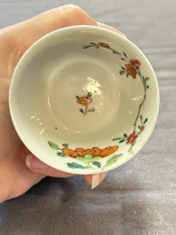 Seven Chinese famille rose cups and eleven saucers with floral design, Qianlong