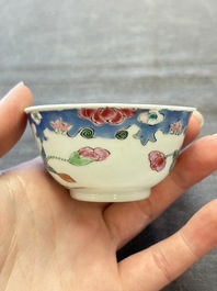 Three Chinese famille rose cups and saucers with a duck among flowering branches, Yongzheng/Qianlong