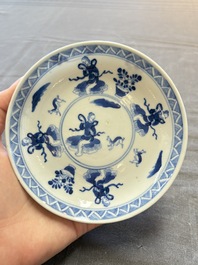 Five Chinese blue and white cups and saucers, Kangxi mark, 19th C.
