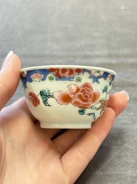 Three Chinese famille rose cups and saucers with a duck among flowering branches, Yongzheng/Qianlong