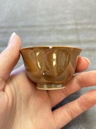 Four Chinese blue and white capucin-ground cups and saucers with landscape design, Yongzheng