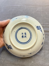 Five Chinese blue and white cups and saucers, Kangxi mark, 19th C.