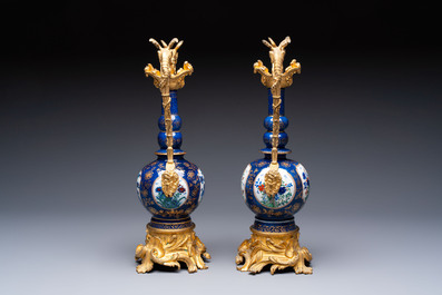 A pair of gilt-bronze-mounted Chinese famille verte powder-blue-ground double gourd vases, 19th C.