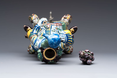 A rare polychrome Dutch Delft figural wine cistern and cover, 18th C.