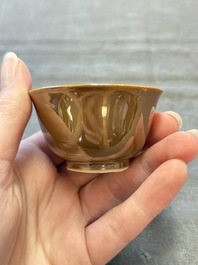 Four Chinese blue and white capucin-ground cups and saucers with landscape design, Yongzheng