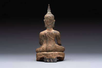Three Southeast Asian bronze Buddhas and a stone head of Buddha, 18th C.