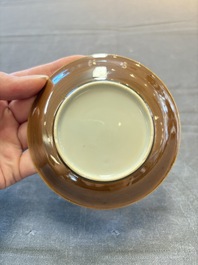 Four Chinese blue and white capucin-ground cups and saucers with landscape design, Yongzheng