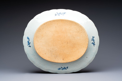 A Chinese blue and white 'ladies in a garden' serving dish, Qianlong
