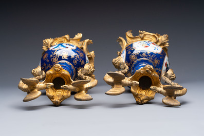 A pair of gilt-bronze-mounted Chinese famille verte powder-blue-ground double gourd vases, 19th C.