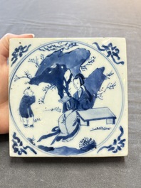 A Chinese blue and white 'elegant beauty and boy' tile, Kangxi