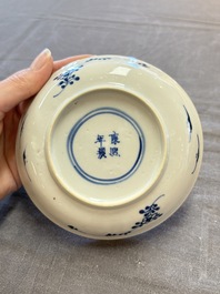 Five Chinese blue and white cups and saucers, Kangxi mark, 19th C.