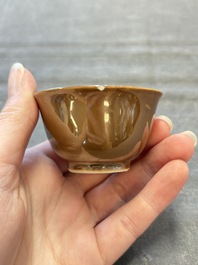 Four Chinese blue and white capucin-ground cups and saucers with landscape design, Yongzheng