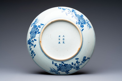 A Chinese blue and white 'Sanxing' dish, Kangxi mark, 19th C.