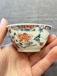 Three Chinese famille rose cups and saucers with a duck among flowering branches, Yongzheng/Qianlong