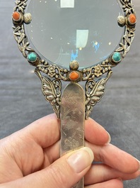 A Chinese silver-mounted magnifying glass with jade handle and precious stone inlays, 19th C.