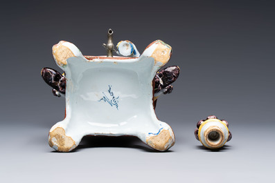 A rare polychrome Dutch Delft figural wine cistern and cover, 18th C.
