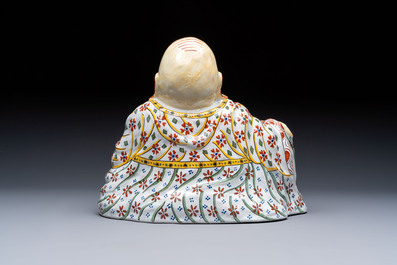 A polychrome Dutch Delft 'Budai' figure, 19th C.