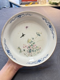 A Chinese famille rose plate with a bird and butterfly among blossoming branches, Yongzheng mark, Republic