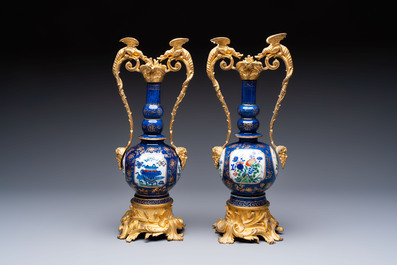 A pair of gilt-bronze-mounted Chinese famille verte powder-blue-ground double gourd vases, 19th C.