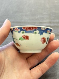 Three Chinese famille rose cups and saucers with a duck among flowering branches, Yongzheng/Qianlong