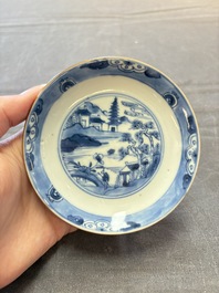 Four Chinese blue and white capucin-ground cups and saucers with landscape design, Yongzheng
