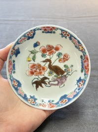 Three Chinese famille rose cups and saucers with a duck among flowering branches, Yongzheng/Qianlong