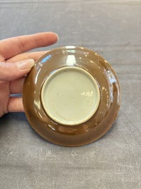 Four Chinese blue and white capucin-ground cups and saucers with landscape design, Yongzheng