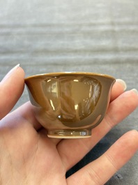 Four Chinese blue and white capucin-ground cups and saucers with landscape design, Yongzheng