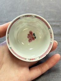 Three Chinese famille rose cups and saucers with a duck among flowering branches, Yongzheng/Qianlong