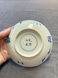 Five Chinese blue and white cups and saucers, Kangxi mark, 19th C.