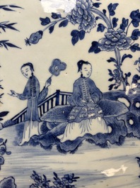 A Chinese blue and white 'ladies in a garden' serving dish, Qianlong