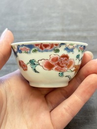 Three Chinese famille rose cups and saucers with a duck among flowering branches, Yongzheng/Qianlong